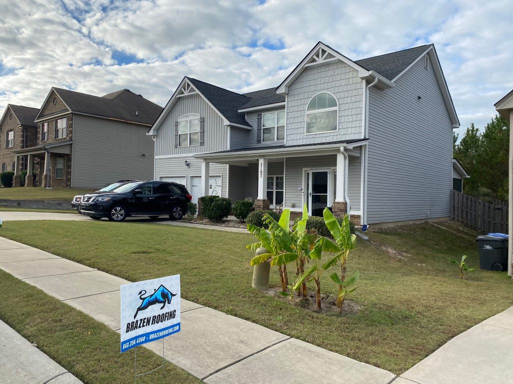 Ground-level view of a completed roofing project in Savannah, GA
